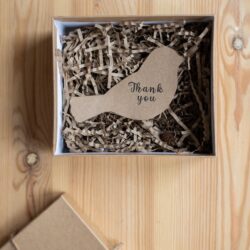 postcard in shape of bird in gift box