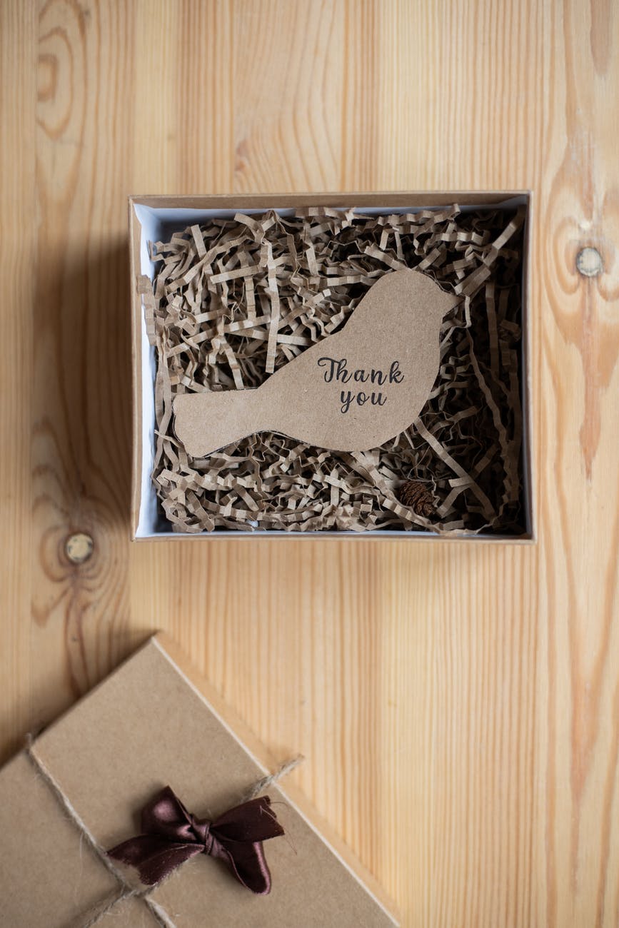 postcard in shape of bird in gift box